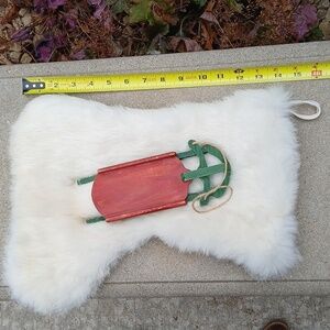 White Rabbit Fur Christmas Stocking with Red and Green Sled